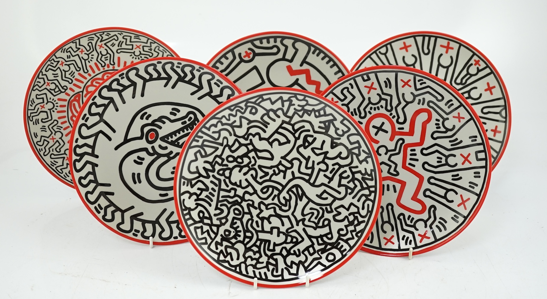 Keith Haring (American, 1958-1990) designs, a set of six Ligne Blanche, Limoges porcelain plates